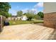 Backyard showcasing a wooden deck, storage shed, and green lawn at 1766 Colony Rd, Rock Hill, SC 29730