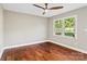 Bedroom with hardwood floors, natural lighting, and a modern fan at 1766 Colony Rd, Rock Hill, SC 29730