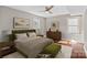 Cozy bedroom with an olive green headboard, ceiling fan, and neutral decor at 1766 Colony Rd, Rock Hill, SC 29730