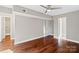 Bedroom featuring hardwood floors, a ceiling fan, and a closet at 1766 Colony Rd, Rock Hill, SC 29730