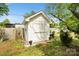 Charming backyard shed nestled among trees, with a well-manicured lawn at 1766 Colony Rd, Rock Hill, SC 29730