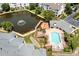 A bird's eye view showcases a community pool, pond and deck area at 18700 Nautical Dr # 203, Cornelius, NC 28031