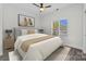 Bright bedroom featuring a ceiling fan, neutral walls, and elegant decor for a serene and stylish space at 18700 Nautical Dr # 203, Cornelius, NC 28031