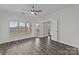 Sunlit bedroom with hardwood floors, ceiling fan, balcony access and expansive windows with lovely views at 18700 Nautical Dr # 203, Cornelius, NC 28031