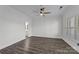 Bright bedroom with modern dark wood floors, plenty of natural light, and neutral paint ready to be decorated at 18700 Nautical Dr # 203, Cornelius, NC 28031
