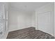 Bright bedroom with natural light, neutral paint and shuttered window ready for your personal touch at 18700 Nautical Dr # 203, Cornelius, NC 28031