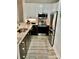 Modern kitchen with stainless steel appliances, granite countertops, and stylish flooring at 18700 Nautical Dr # 203, Cornelius, NC 28031