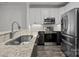 Stylish kitchen with granite countertops, stainless steel appliances, and modern lighting at 18700 Nautical Dr # 203, Cornelius, NC 28031
