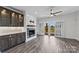 Cozy living area with a fireplace, custom built-ins, and access to the outdoor balcony at 18700 Nautical Dr # 203, Cornelius, NC 28031