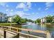 Scenic view of a community pond with a fountain and residential buildings in the background at 18700 Nautical Dr # 203, Cornelius, NC 28031