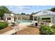 Community pool with lounge chairs and pergola, perfect for relaxation and outdoor enjoyment at 18700 Nautical Dr # 203, Cornelius, NC 28031