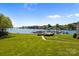 Beautiful waterfront view featuring a well-maintained lawn, access to the marina, and tranquil lake scenery at 18700 Nautical Dr # 203, Cornelius, NC 28031