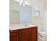 Bathroom with a single sink vanity, large mirror, and shower/tub combo at 1910 Mezzo Ct, Matthews, NC 28105