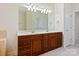 Bathroom with double sink vanity, large mirror, and modern fixtures at 1910 Mezzo Ct, Matthews, NC 28105