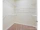 Walk-in closet with wire shelving and carpet at 1910 Mezzo Ct, Matthews, NC 28105