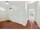 Inviting foyer with hardwood flooring and convenient coat closet offers a welcoming first impression at 1910 Mezzo Ct, Matthews, NC 28105
