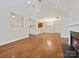 Spacious living room with hardwood floors, fireplace, and vaulted ceilings offers a bright open space at 1910 Mezzo Ct, Matthews, NC 28105