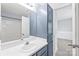 Bathroom featuring vanity with a white sink and blue cabinet at 2059 Lennox Square Rd, Charlotte, NC 28210