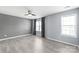 Spacious bedroom with hardwood floors and large windows at 2059 Lennox Square Rd, Charlotte, NC 28210