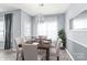 Dining room with table set for six and modern chandelier at 2059 Lennox Square Rd, Charlotte, NC 28210
