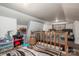 Attic with wood flooring and security gate on stairs, plus toys and additional storage at 211 Hershel Lackey Rd, Lincolnton, NC 28092