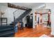 Inviting entryway with wooden floors, staircase, and access to the dining room at 211 Hershel Lackey Rd, Lincolnton, NC 28092