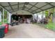 View of open garage area with storage, work and recreational equipment at 211 Hershel Lackey Rd, Lincolnton, NC 28092