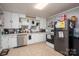 Efficient kitchen with white cabinets, modern appliances, and ample counter space at 211 Hershel Lackey Rd, Lincolnton, NC 28092