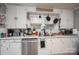 Bright kitchen showcasing white cabinetry, stainless steel dishwasher, and a double bowl sink at 211 Hershel Lackey Rd, Lincolnton, NC 28092