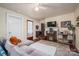 Cozy living room with fireplace, TV, and comfortable sectional couch at 211 Hershel Lackey Rd, Lincolnton, NC 28092
