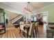 Dining area with a view to staircase, dining table with chairs, and living room in the background at 228 Red Dog Dr, Mooresville, NC 28115