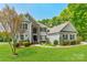 Charming two-story home with a well-manicured lawn, tasteful landscaping, and a welcoming entrance at 228 Red Dog Dr, Mooresville, NC 28115