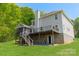 Exterior elevation with a walkout basement, screened-in porch, and tiered decks at 228 Red Dog Dr, Mooresville, NC 28115