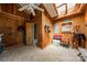Spacious tack room features wooden paneling, ceiling fan, and saddle racks at 228 Red Dog Dr, Mooresville, NC 28115