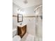 Bathroom with a white tile wall, glass door shower, and vanity at 2614 Thornton Rd, Charlotte, NC 28208