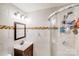 Bathroom featuring white tile walls and glass door shower at 2614 Thornton Rd, Charlotte, NC 28208