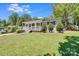 Charming home with well-kept lawn and mature trees at 2614 Thornton Rd, Charlotte, NC 28208