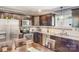 Well-lit kitchen featuring stainless steel appliances and granite countertops at 2614 Thornton Rd, Charlotte, NC 28208