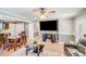 Bright living room featuring a ceiling fan, fireplace, hardwood floors, and neutral paint at 2614 Thornton Rd, Charlotte, NC 28208