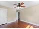 Bedroom with hardwood floors, a ceiling fan, and a bright, neutral wall color at 2721 Albany Ln, Charlotte, NC 28205
