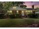 Charming single-story brick home with a well-maintained lawn and manicured hedges at 2721 Albany Ln, Charlotte, NC 28205