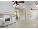 Updated kitchen featuring white cabinets and stainless steel appliances, adjacent to an inviting living space at 2721 Albany Ln, Charlotte, NC 28205