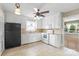 Kitchen featuring white cabinets, tiled floor and modern appliances at 2721 Albany Ln, Charlotte, NC 28205