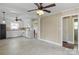 Open kitchen area with tile flooring, white cabinets and open layout at 2721 Albany Ln, Charlotte, NC 28205