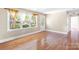 Living room with hardwood floors, large windows, and natural light at 2721 Albany Ln, Charlotte, NC 28205