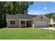 Charming single-story home with well-maintained lawn, attached garage, and classic design at 3021 Dylan Nw Pl, Concord, NC 28027
