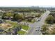 A vibrant aerial view shows the home's location near major intersections and Charlotte's skyline in the background at 3804 Freedom Dr, Charlotte, NC 28208