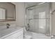 Modern bathroom with tile surround shower and tub, quartz countertops, and neutral walls at 3804 Freedom Dr, Charlotte, NC 28208