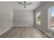 Bedroom featuring two large windows for abundant natural light, new floors and neutral paint at 3804 Freedom Dr, Charlotte, NC 28208