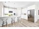 Modern kitchen featuring stainless steel appliances, white cabinetry, and a breakfast bar with seating for three at 3804 Freedom Dr, Charlotte, NC 28208